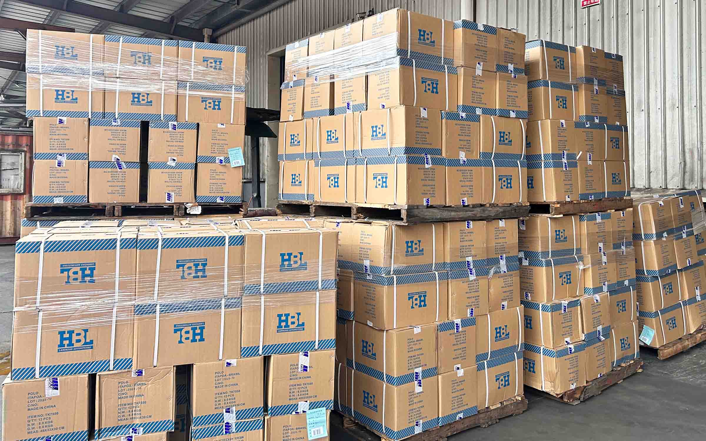 Stacked AC compressor cartons in Elecdura warehouse for stable supply