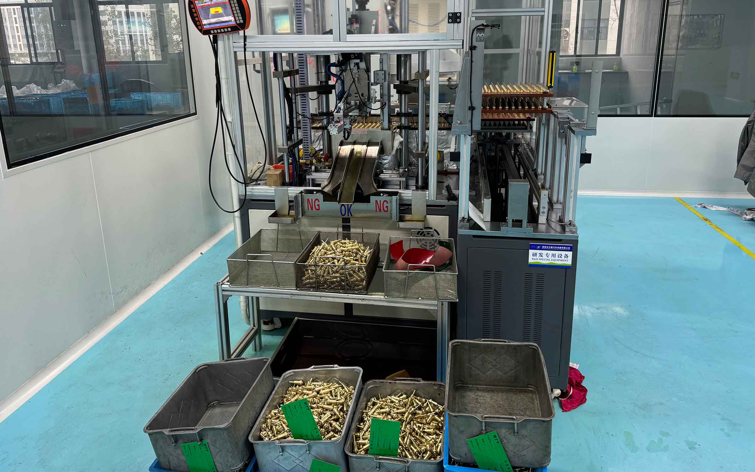 Automotive thermostat production equipment in operation