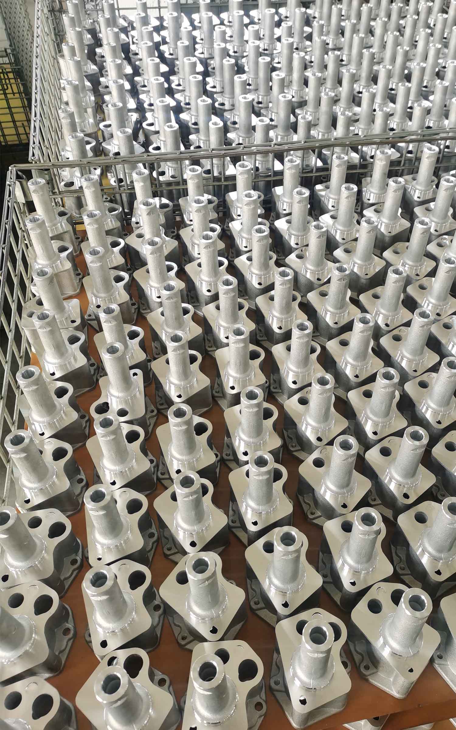 Rows of finished automotive thermostats in inspection area