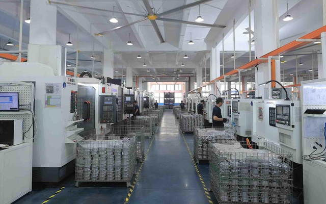 Workers assembling compressors in the factory