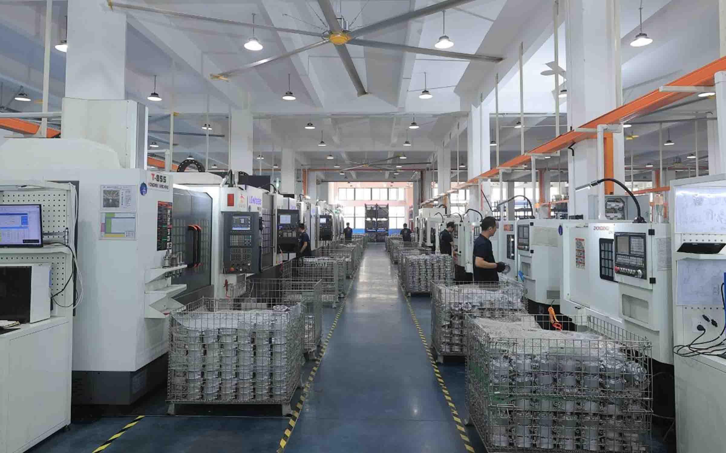 Skilled workers assembling automotive AC compressors for wholesale supply