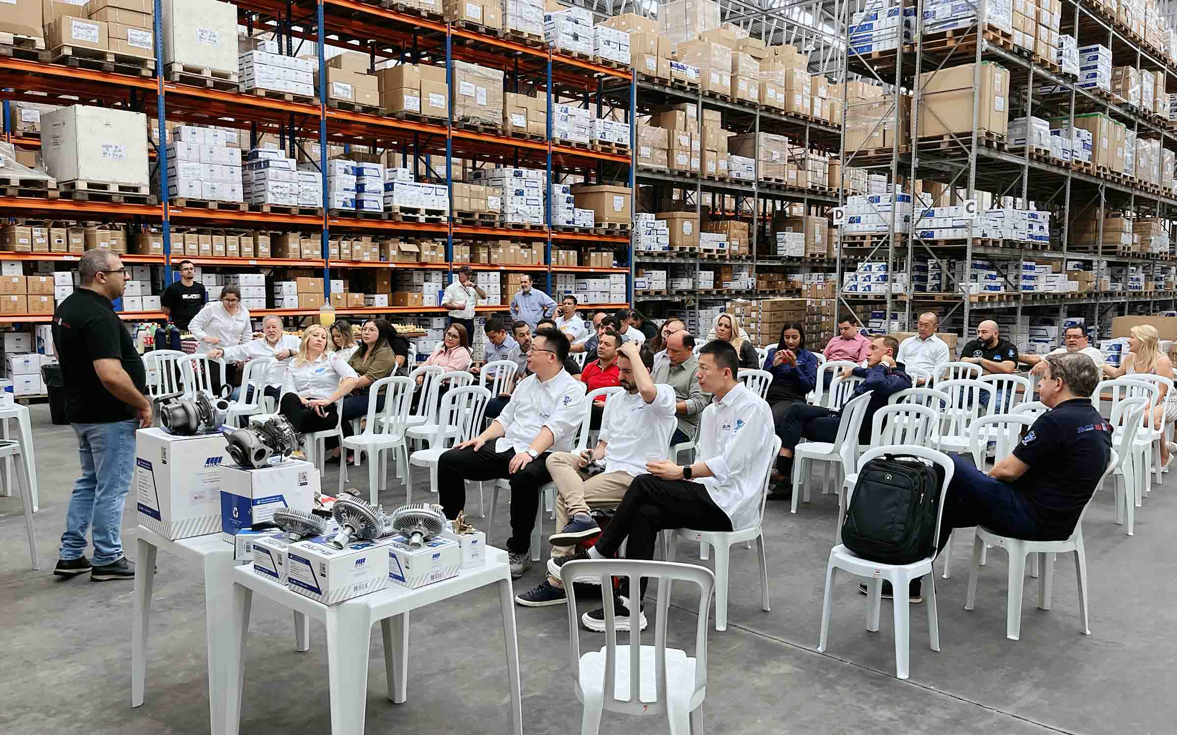 Elecdura team with partners at international automotive parts exhibition demonstrating global cooperation