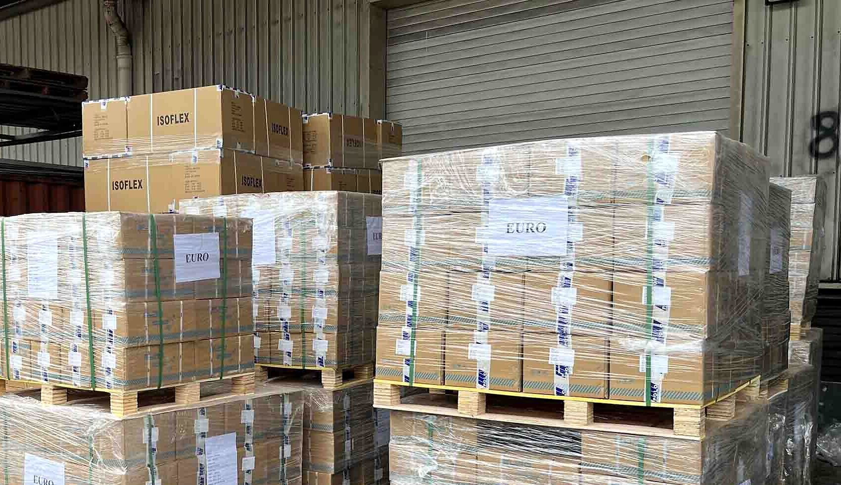 Customer-branded cartons palletized and wrapped for dispatch