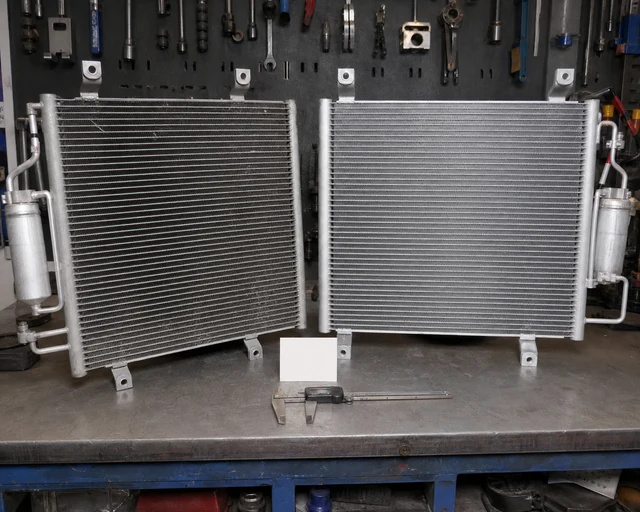 Truck AC condenser old and replacement core comparison for bracket and port matching