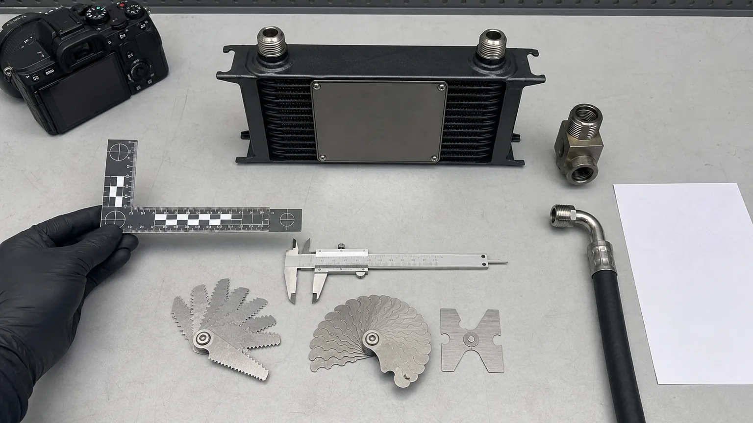 Hydraulic oil cooler RFQ photo evidence with scale caliper pitch gauge sealing seat OE label and machine data