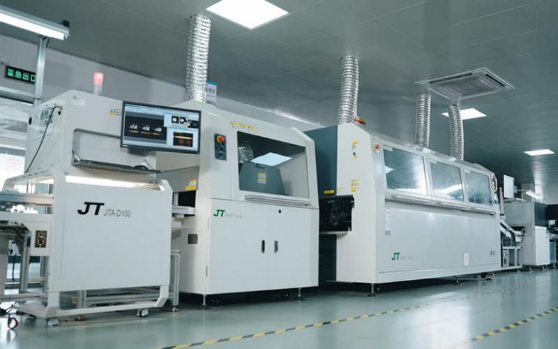 Industrial-grade SMT production line and reflow oven for robust electronic component integration.