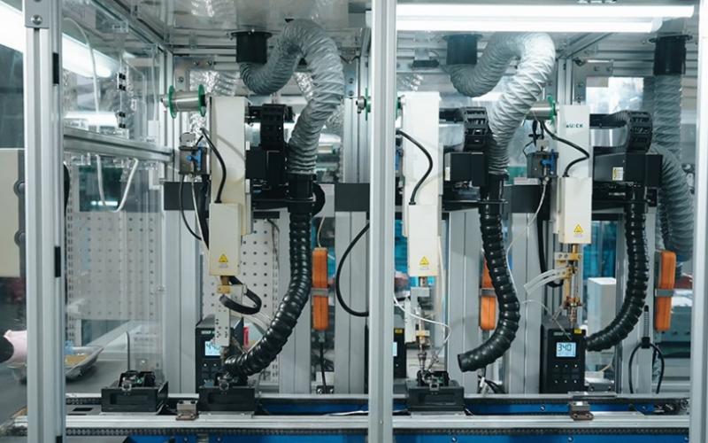 Multi-axis robotic arms performing synchronized assembly to eliminate human error and ensure consistency.