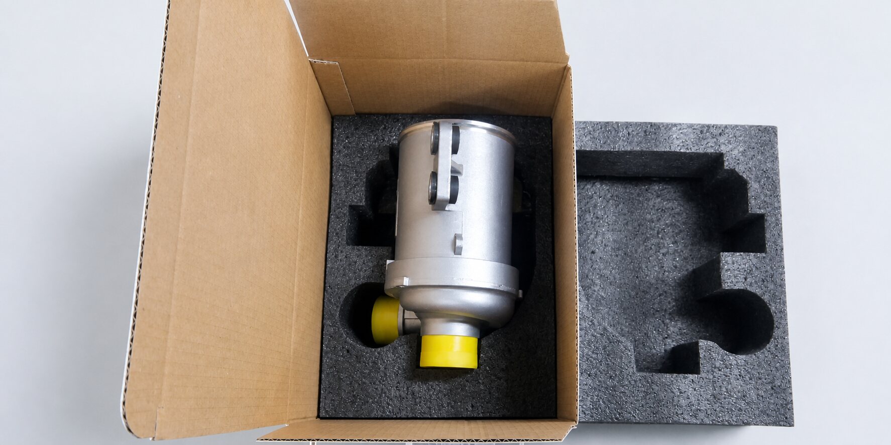 Oil cooler module protected in custom-cut foam inside a shipping carton